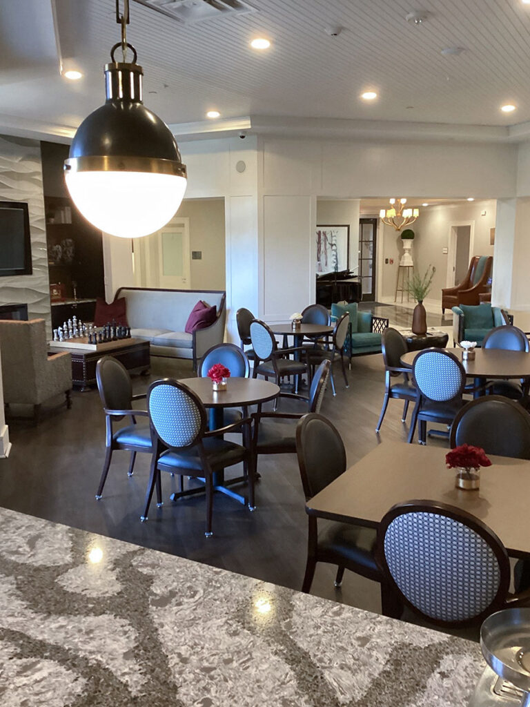 The restaurant dining at Town and Country Senior Living features cozy seating and elegant decor.