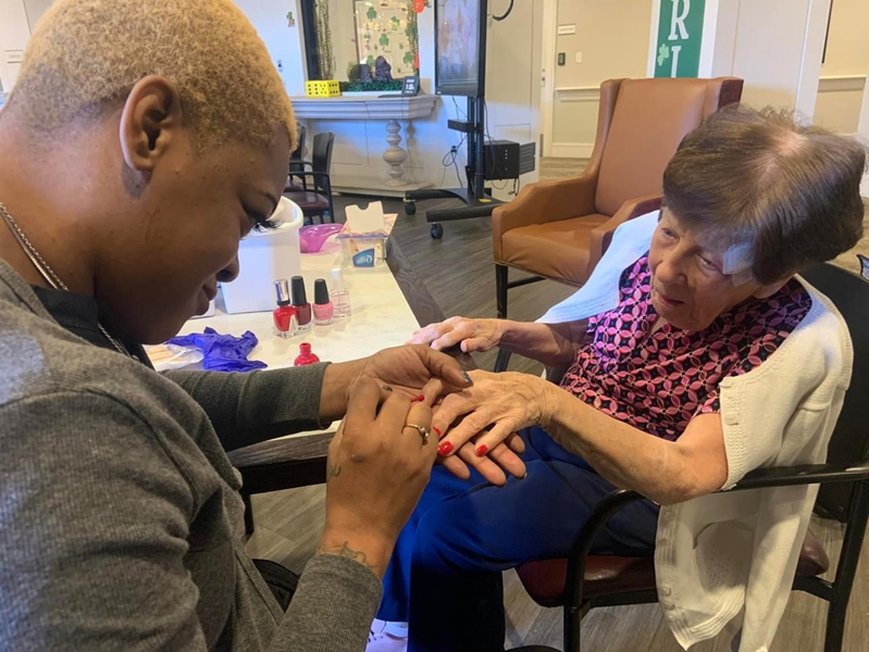 A kind-hearted volunteer brings joy to memory care residents by giving them beautiful manicures.